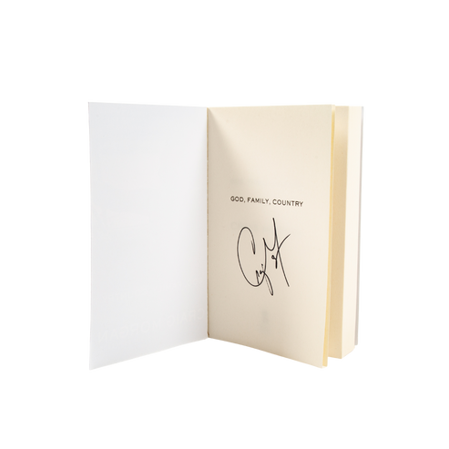 Open book with 'God, Family, Country' text on a white background